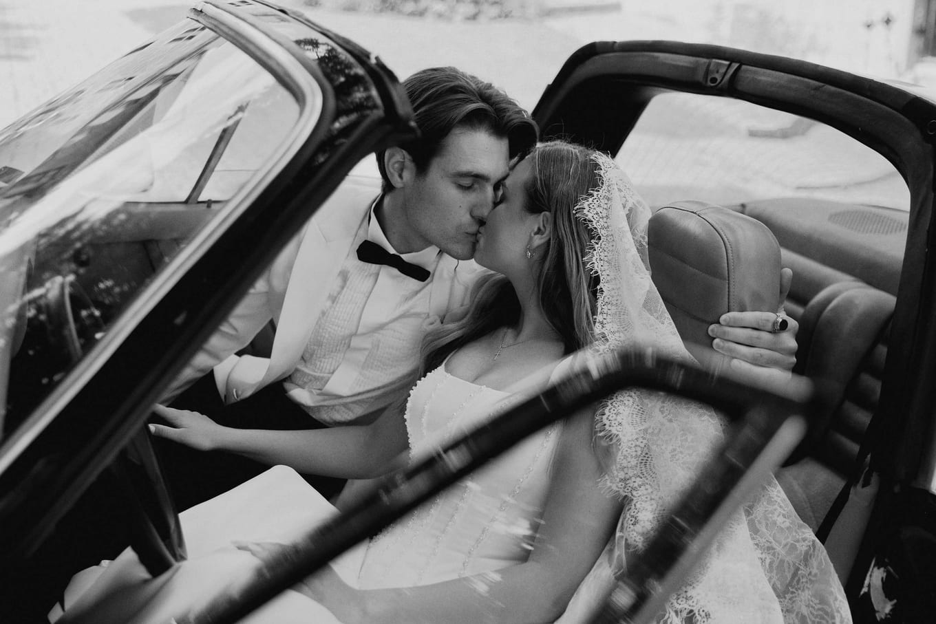 A kiss in the front seats before driving to the church