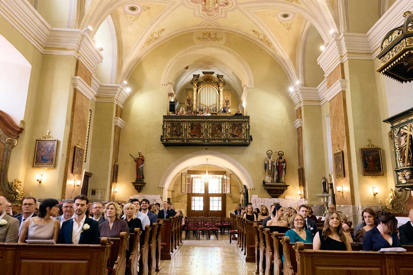 View down the nave with guests waiting on both sides