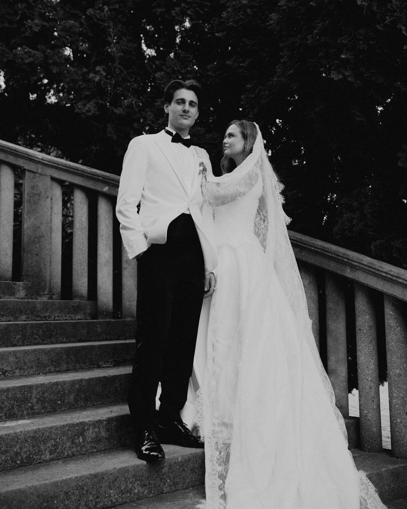 The couple on the château's stone staircase