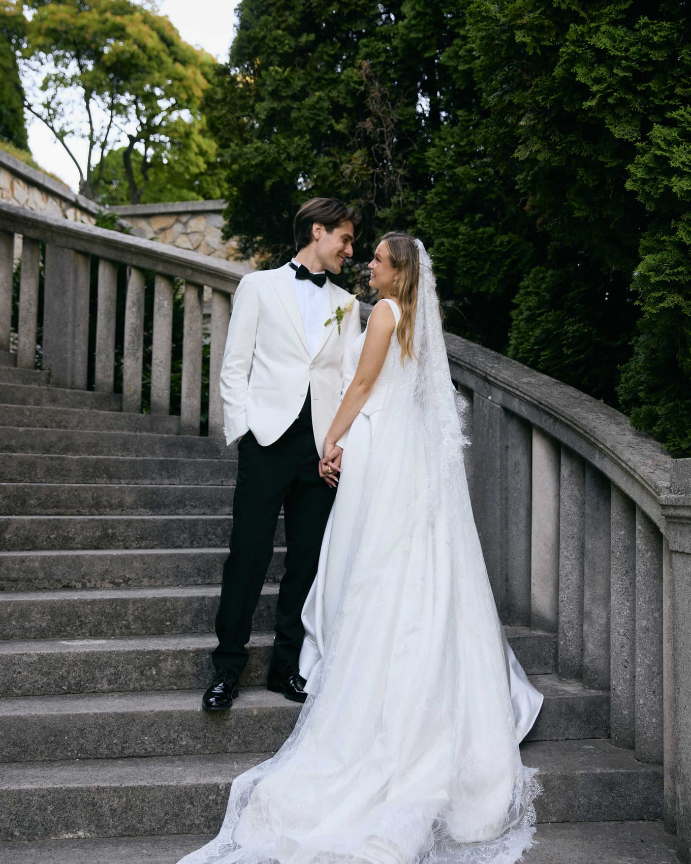 Hand in hand on the balustraded staircase