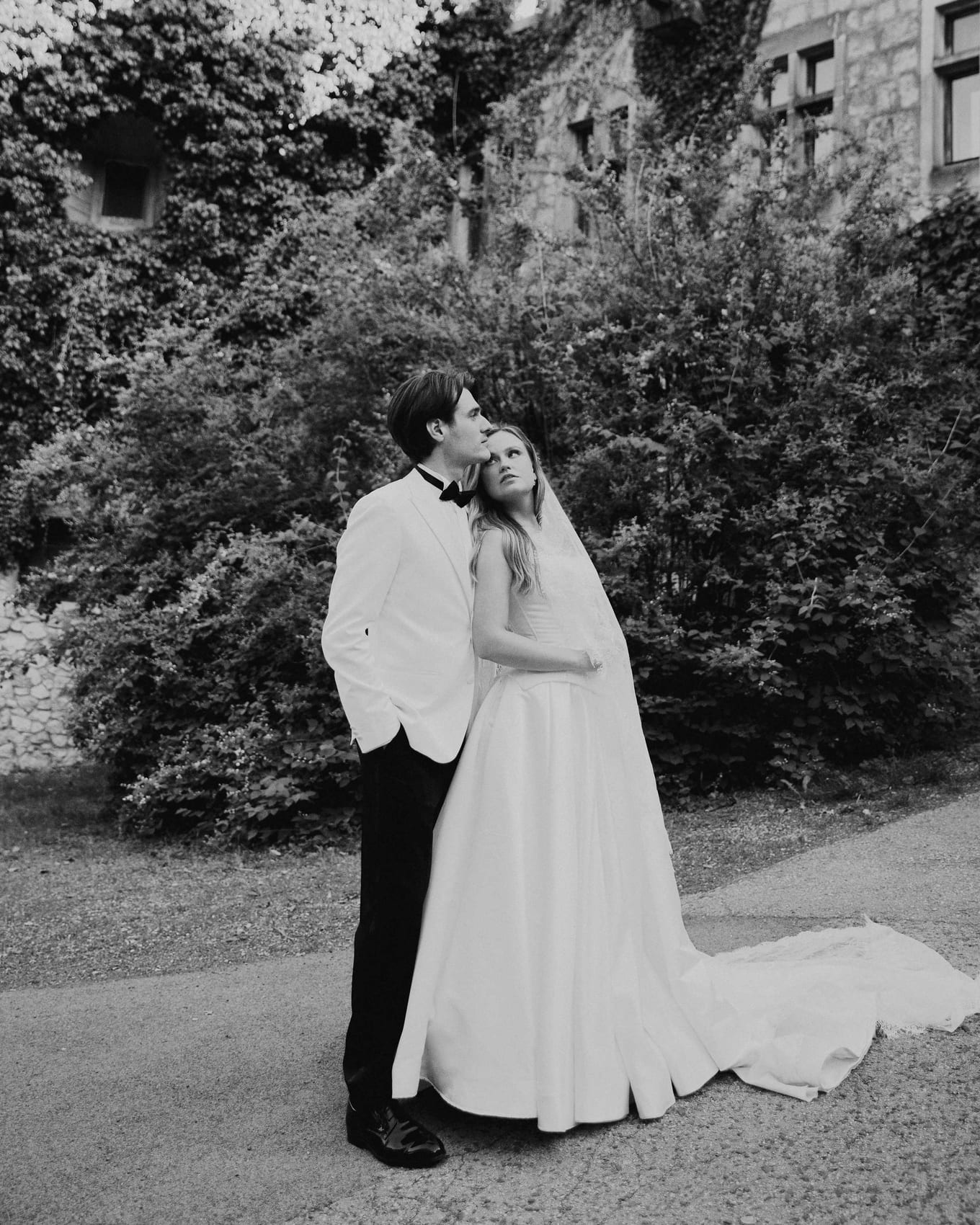 A kiss on the tree-lined path