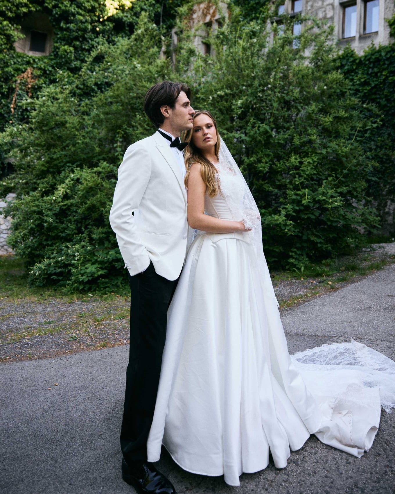 The couple embracing beside the drive