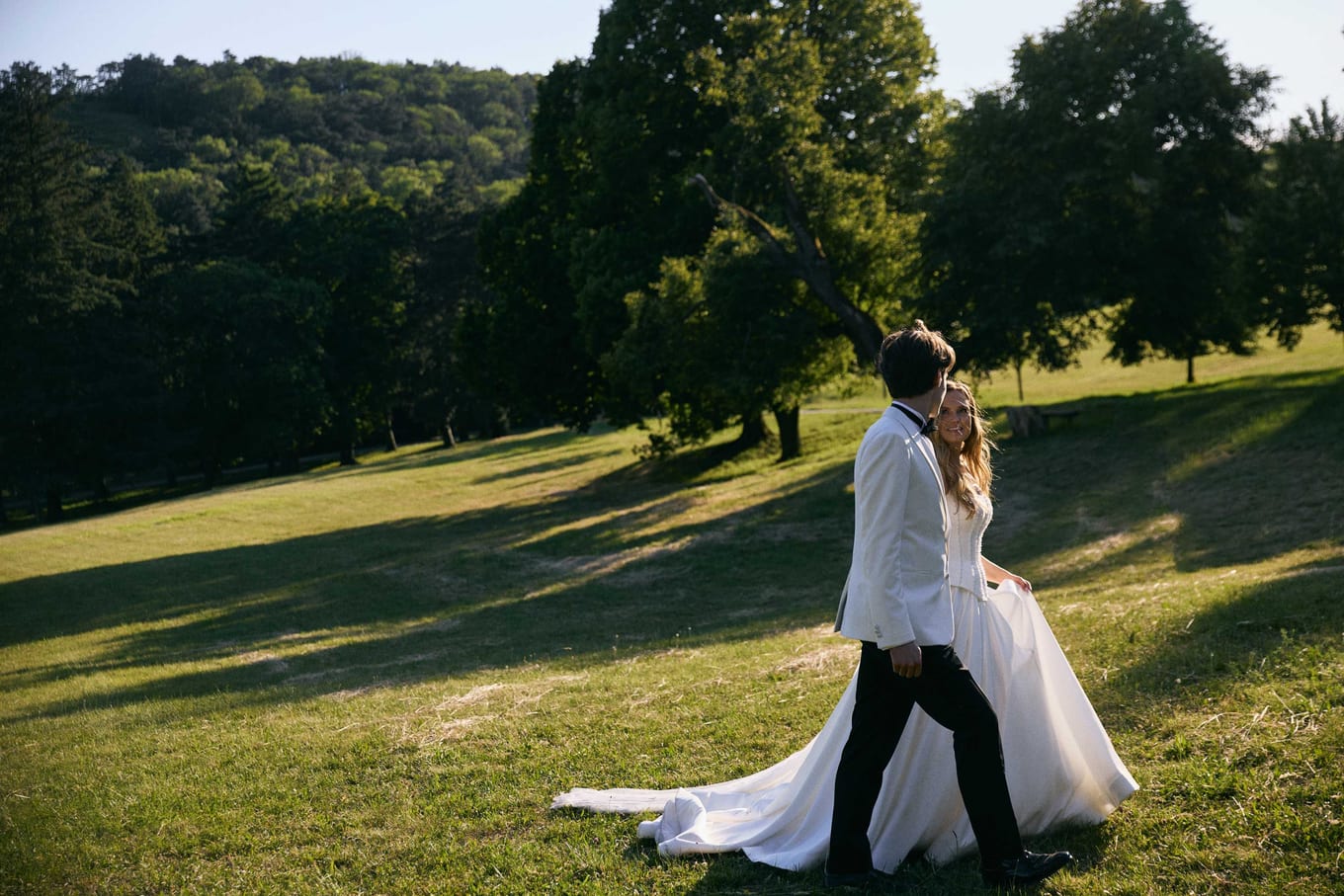 A kiss in the parkland at golden hour